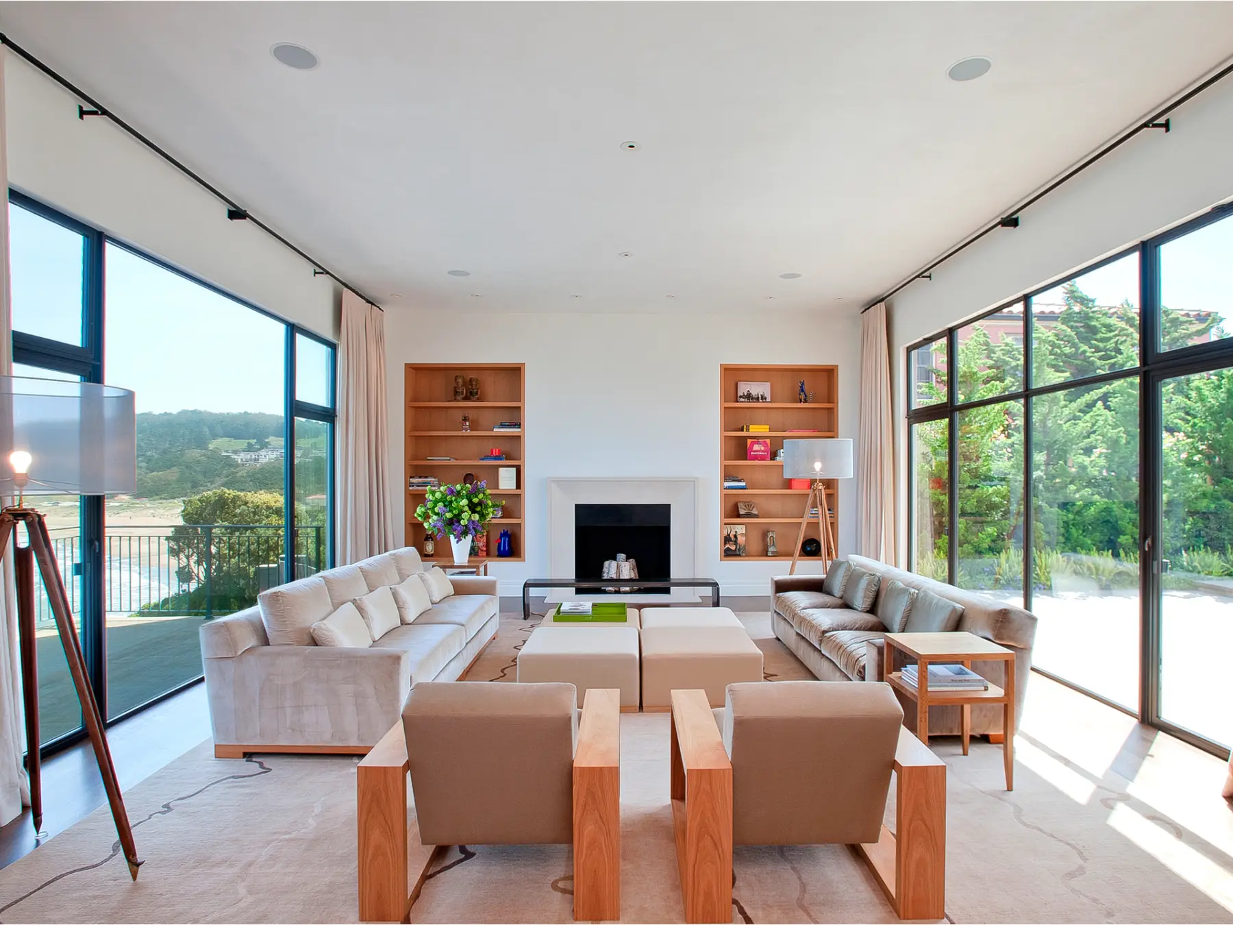 Living room at a family home in Sea Cliff featuring expansive windows on both sides of the room