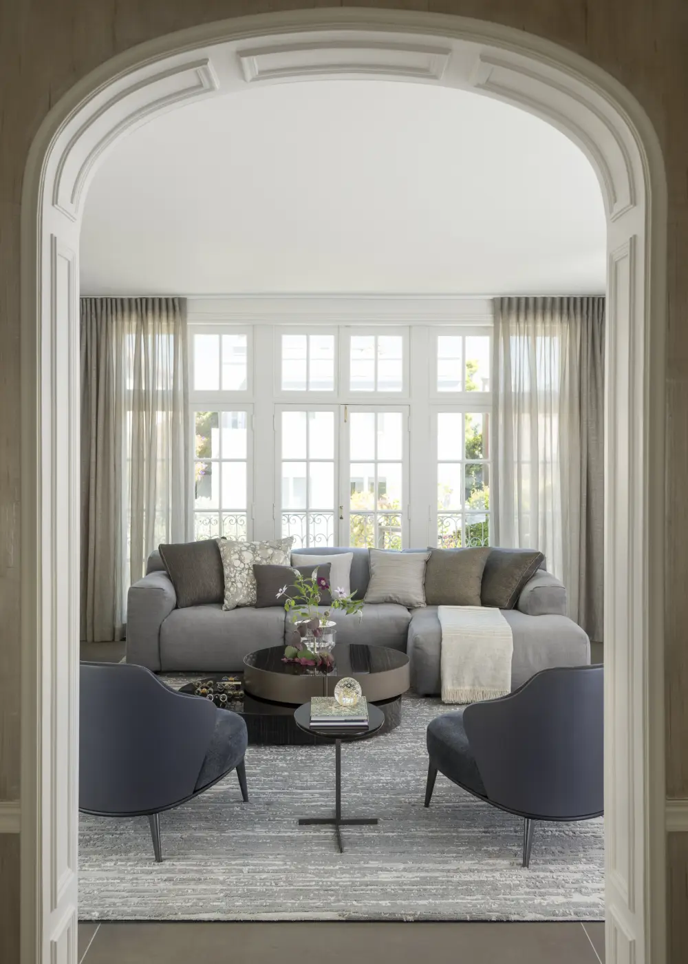 1920's archway detail frames the view in the new sleek living space.