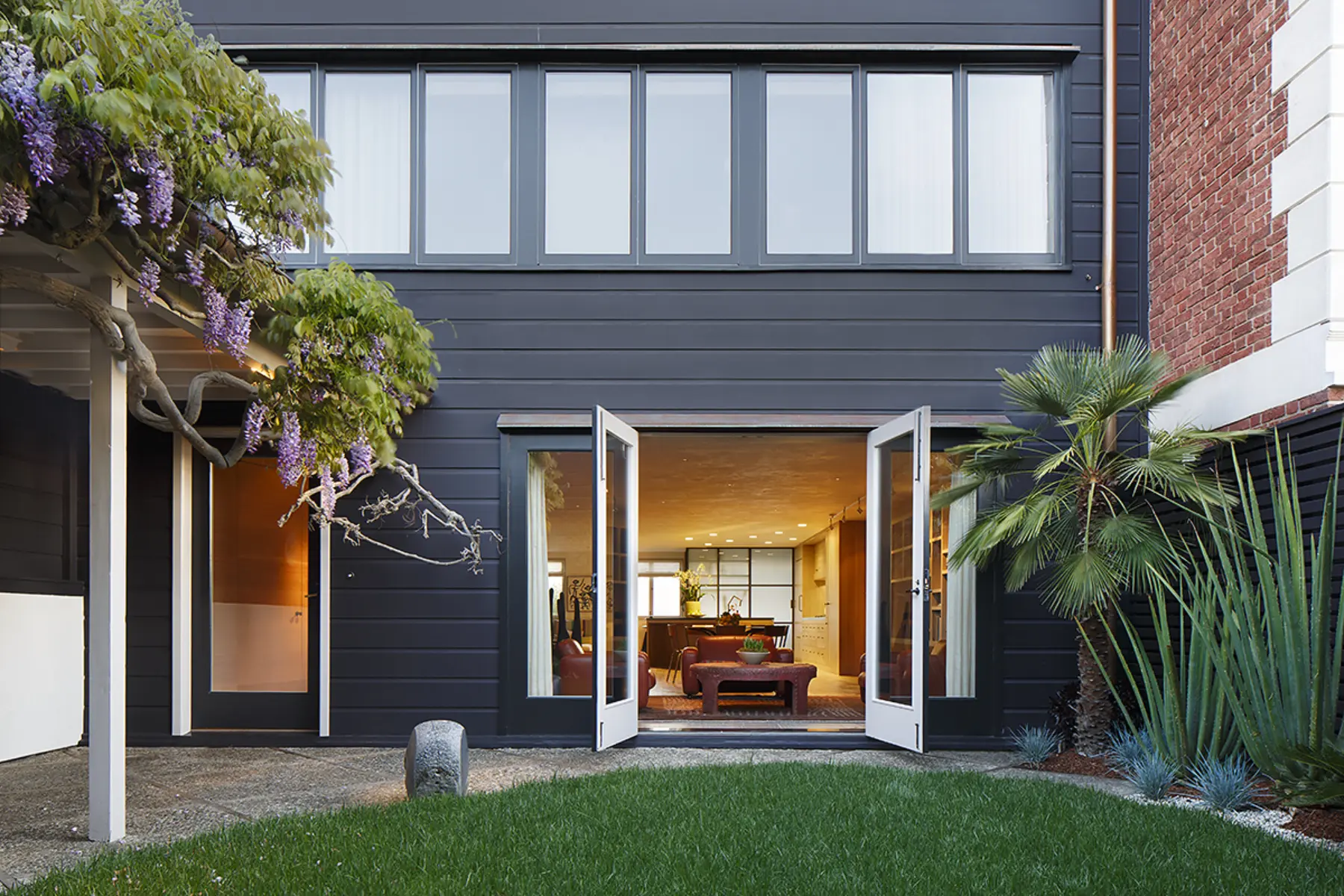 San Francisco Wurster back facade with doors that open up to grassy backyard